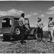 Cover image of Three unidentified people with jeep