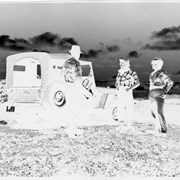 Cover image of Three unidentified people with jeep - negative
