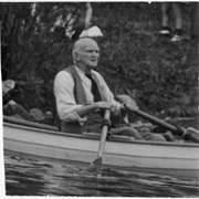 Cover image of Norman Sanson in row boat - close-up