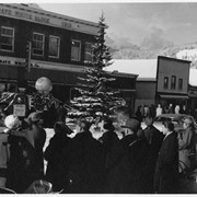 Cover image of Group of people on Banff Avenue in winter