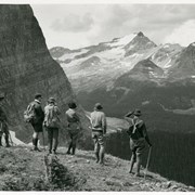 Cover image of Group of hikers on a grassy ledge