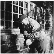 Cover image of Unidentified man outside stone building