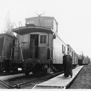 Cover image of Unidentified men beside train
