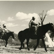 Cover image of Unidentified woman and child on horseback