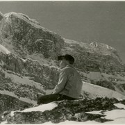 Cover image of Unidentified man sitting on a rock
