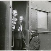Cover image of Unidentified people boarding train