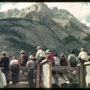 Cover image of Men along a fence with Cascade Mountain
