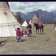 Cover image of Unidentified people outside tepees