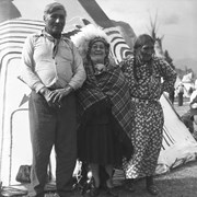 Cover image of Tom Kaquitts (Sûga Wakâ) (Dog God), Annie White and Agnes Kaquitts at Banff Indian Days