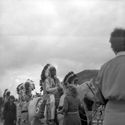 Cover image of Banff Indian Days Parade and spectators on Bow River Bridge