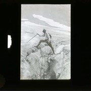 Cover image of [Malcolm Geddes?] posing by glacier crevice